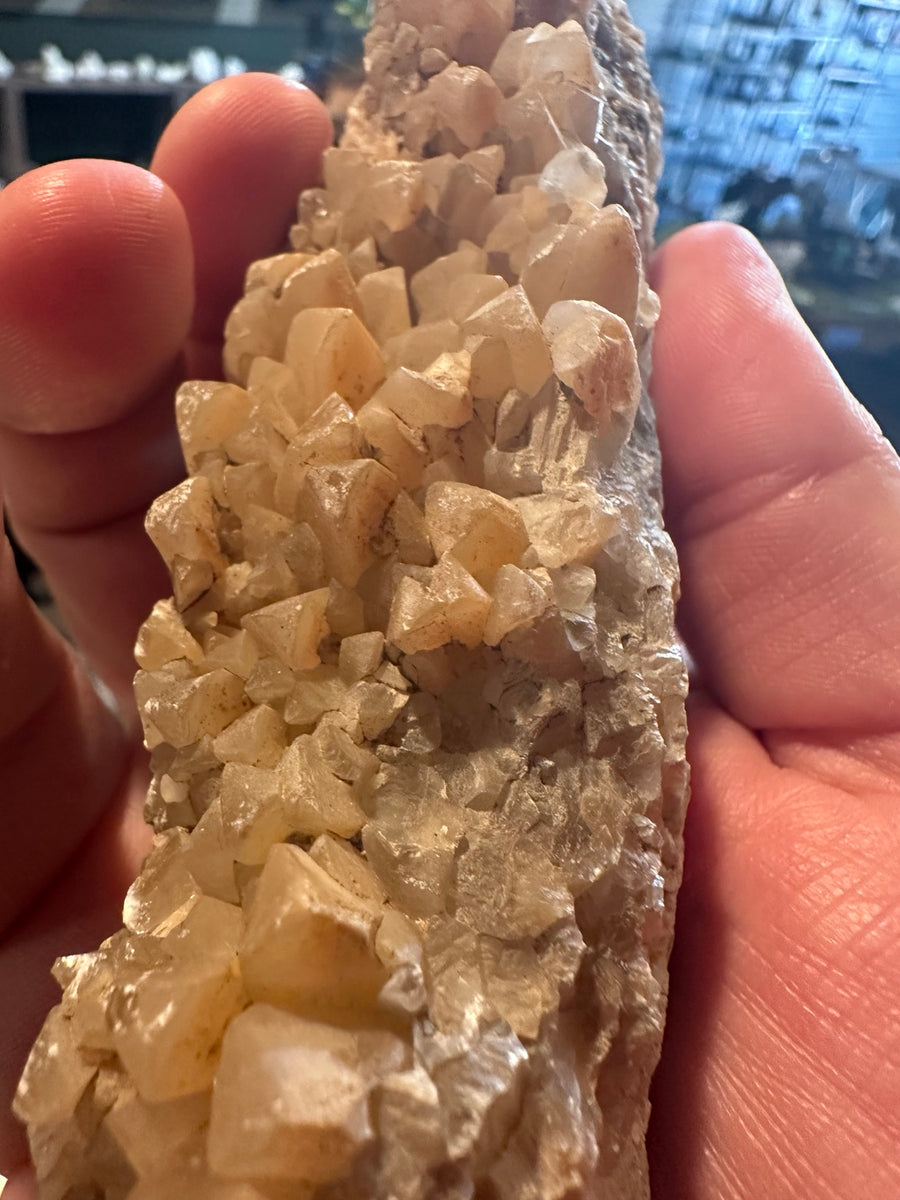 Fluorescent calcite crystal cluster on matrix, detail