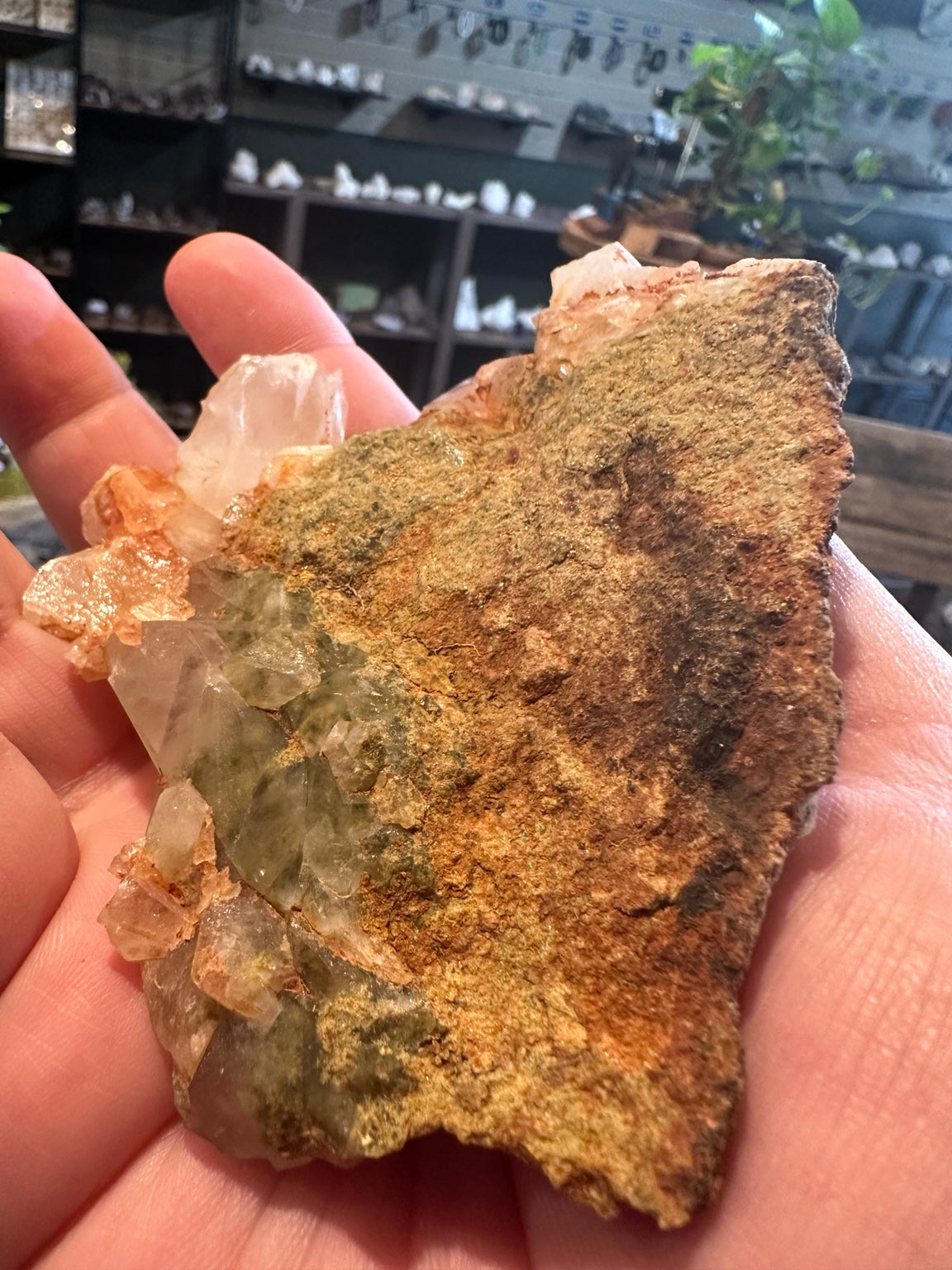 Angular prismatic and peach colored crystals in Mexican natural mineral cluster