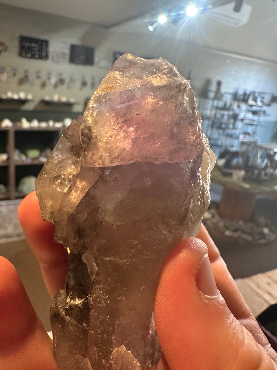 Large smoky quartz point with clear quartz side termination macro view