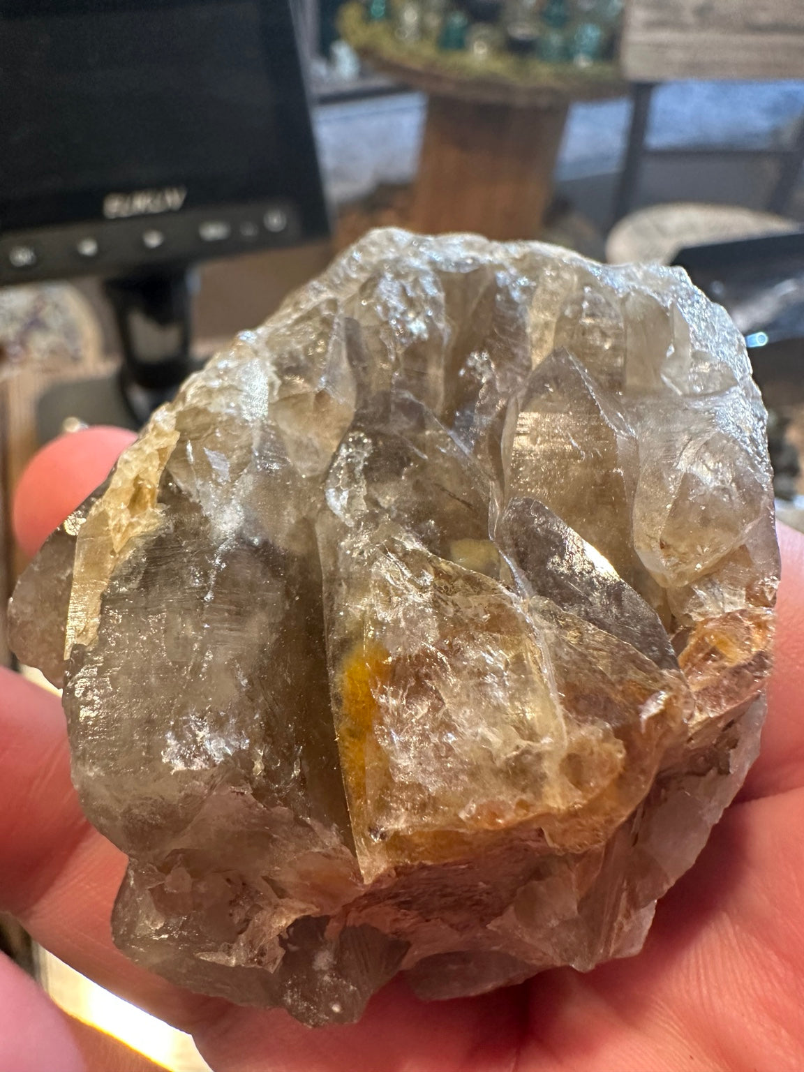 Alternate angled view of multi-point pale smoky quartz cluster with complex layered crystal surfaces