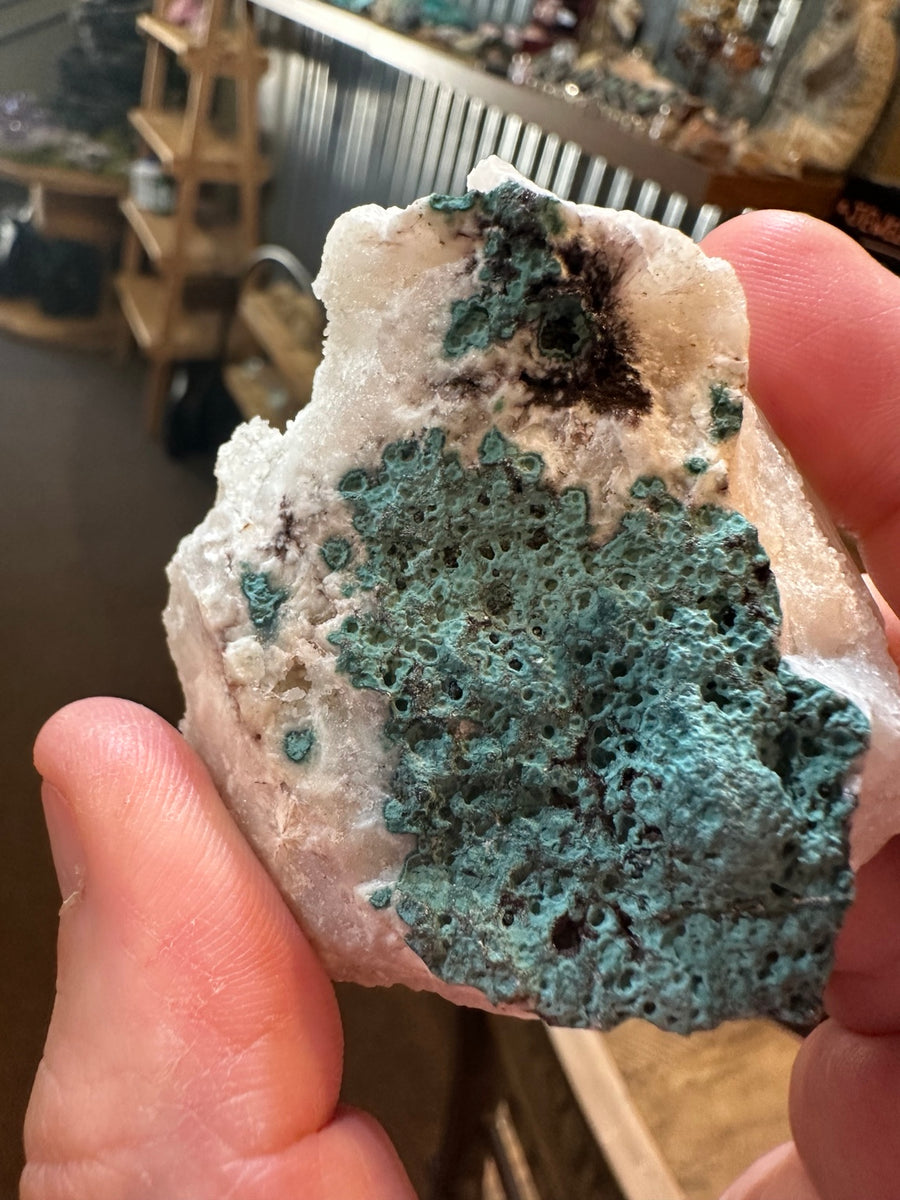 Arkansas quartz crystal cluster with blue-green mineralization — view 1
