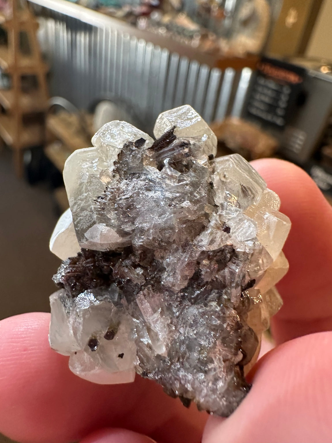 White barite crystal cluster on dark iron-oxide-rich matrix from the Western U.S. — view 3