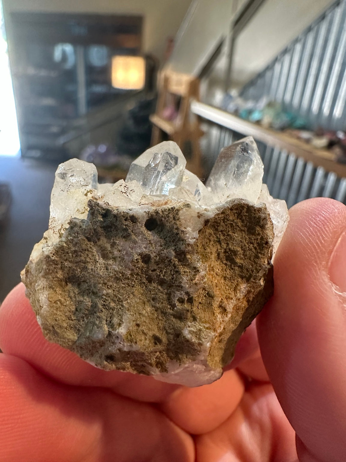 Close view of a large terminated quartz point on Brazilian cluster