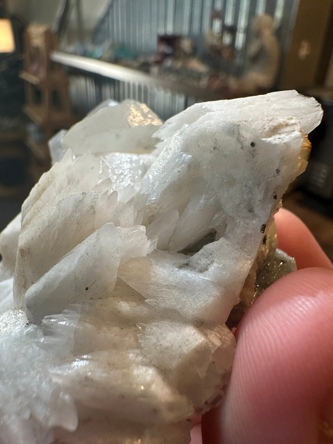 Brazilian quartz crystal cluster with white bladed crystal growth and green mineralization — view 2