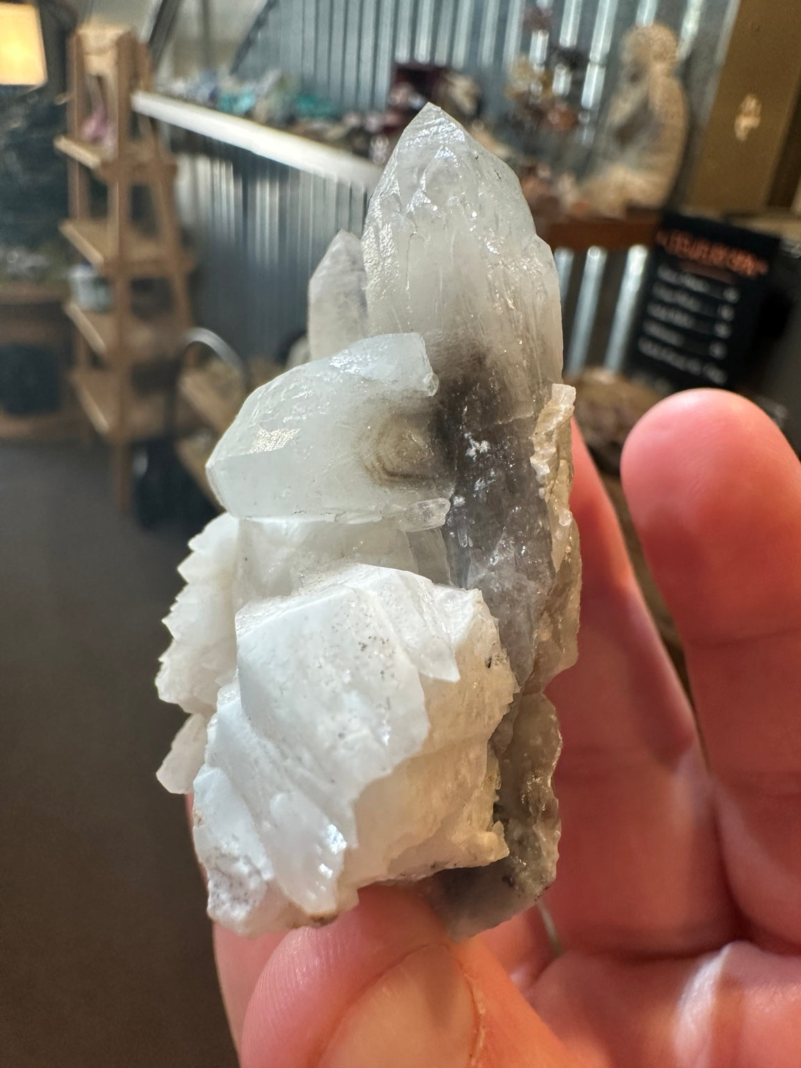 Brazilian quartz crystal cluster with white bladed crystal growth and green mineralization — view 3