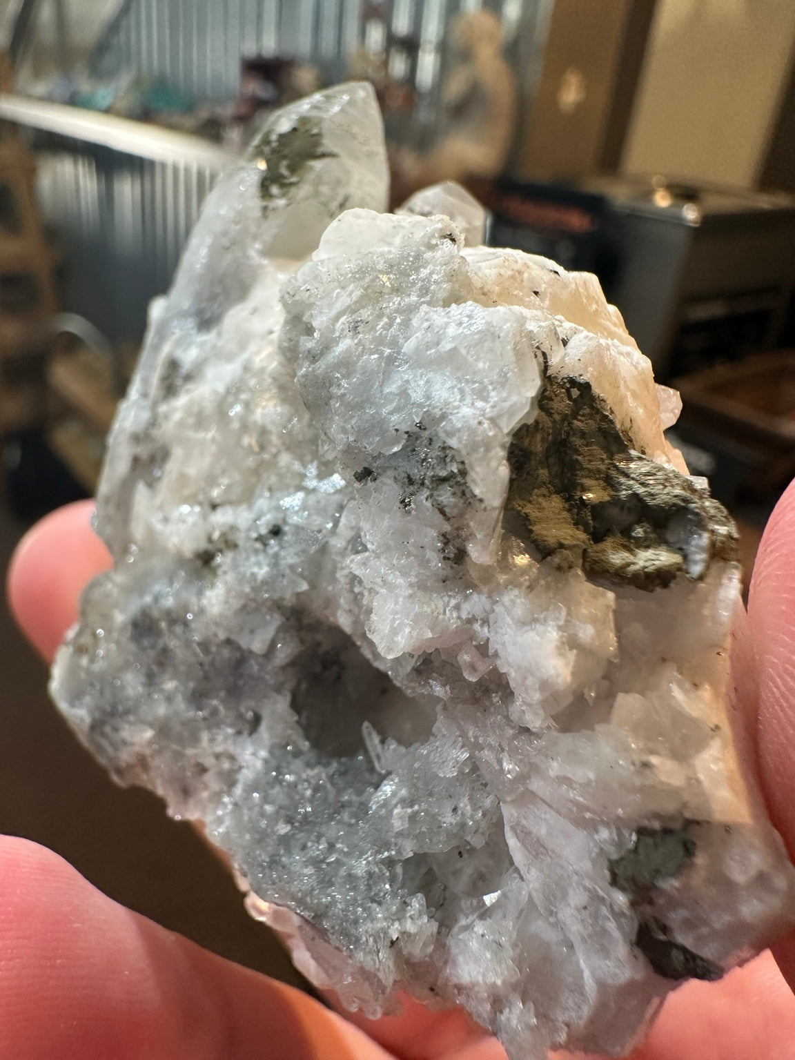 Brazilian quartz crystal cluster with white bladed crystal growth and green mineralization — view 6