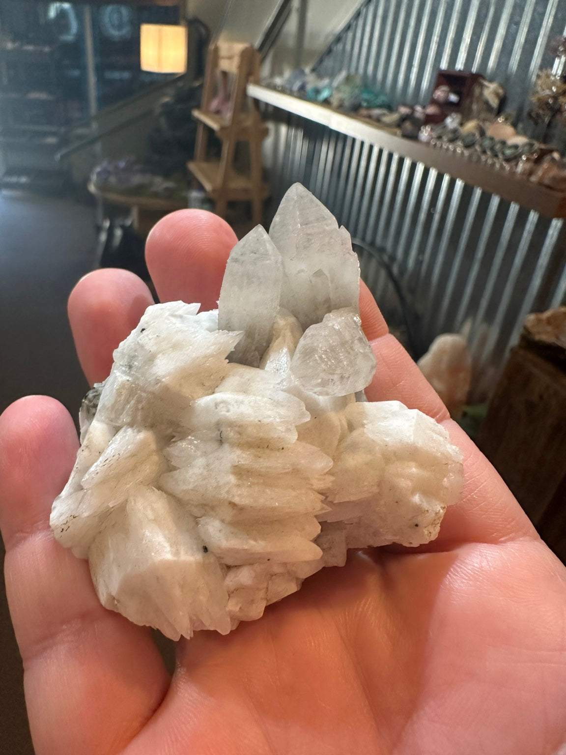 Brazilian quartz crystal cluster with white bladed crystal growth and green mineralization — view 7