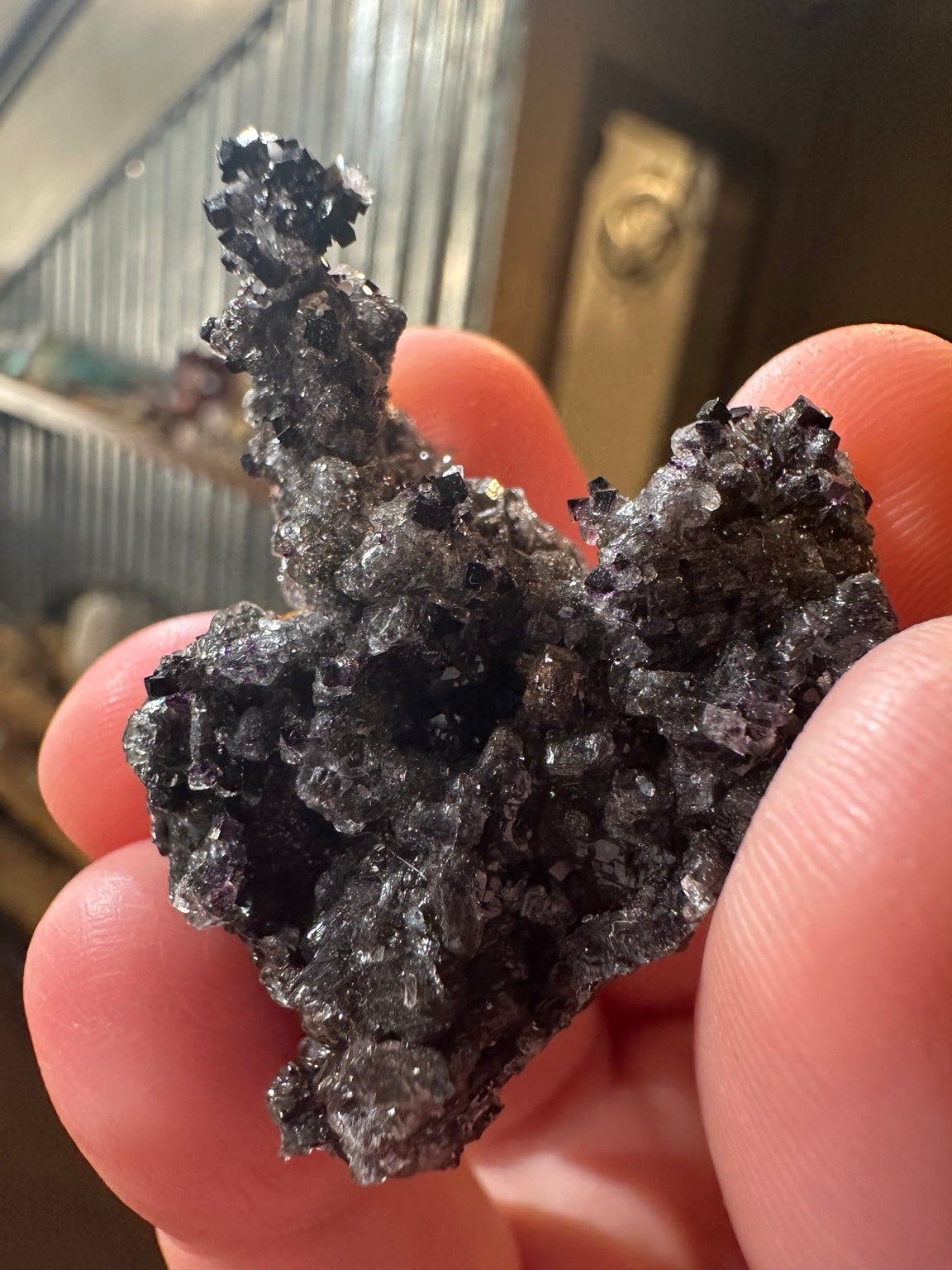 Rare dark violet cubic fluorite on goethite from Nevada — view 5