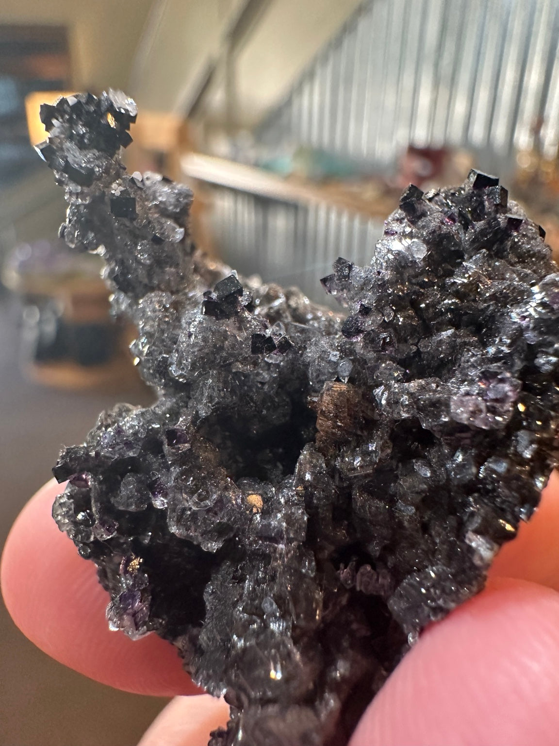 Rare dark violet cubic fluorite on goethite from Nevada — view 8