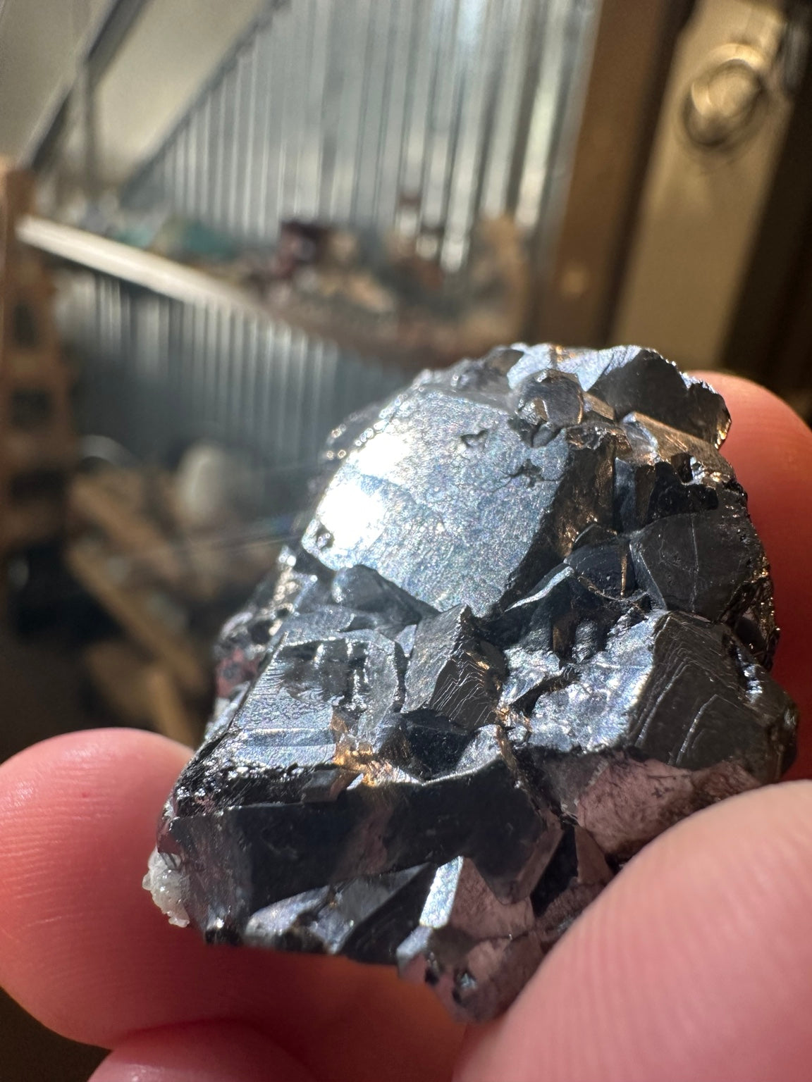 Metallic hematite crystal cluster with quartz from Nevada — view 2
