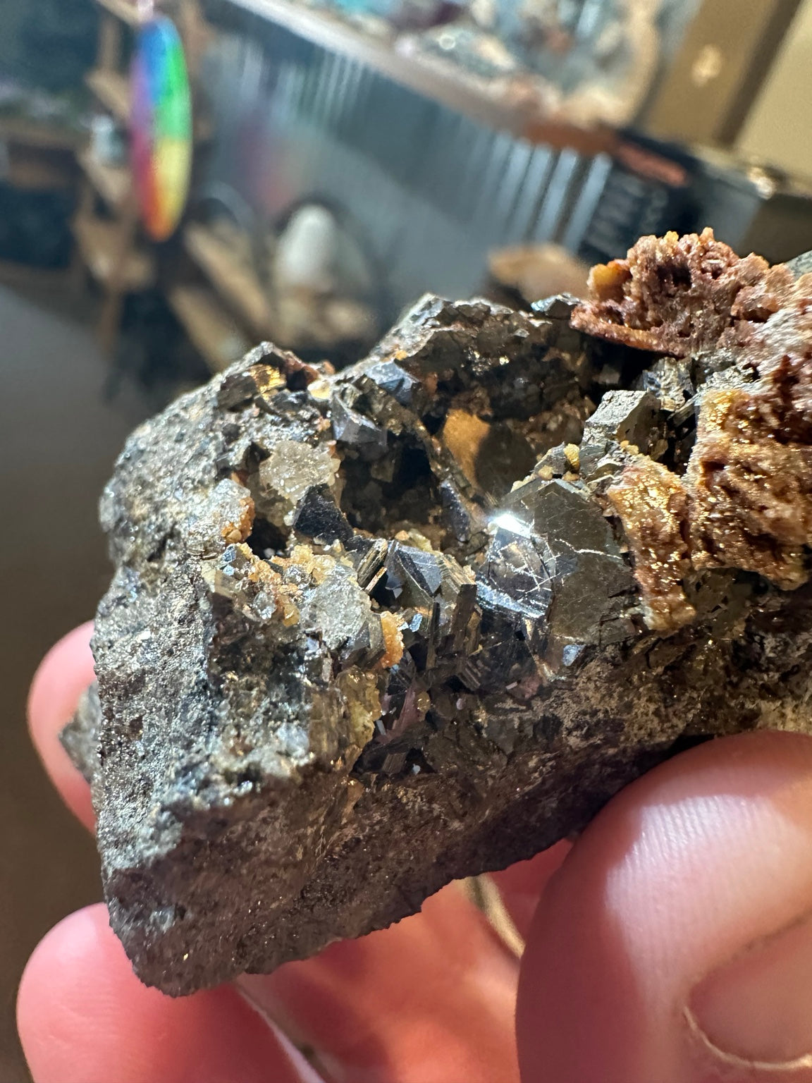 Reported Nevada 6.1 oz mixed sulfide specimen with dark lustrous crystals and rust orange mineral growth; image 1