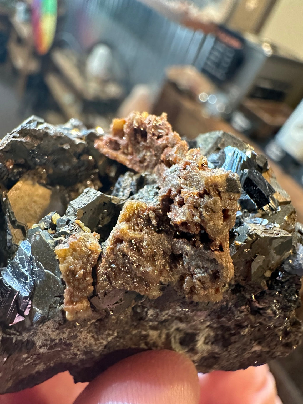 Reported Nevada 6.1 oz mixed sulfide specimen with dark lustrous crystals and rust orange mineral growth; image 2