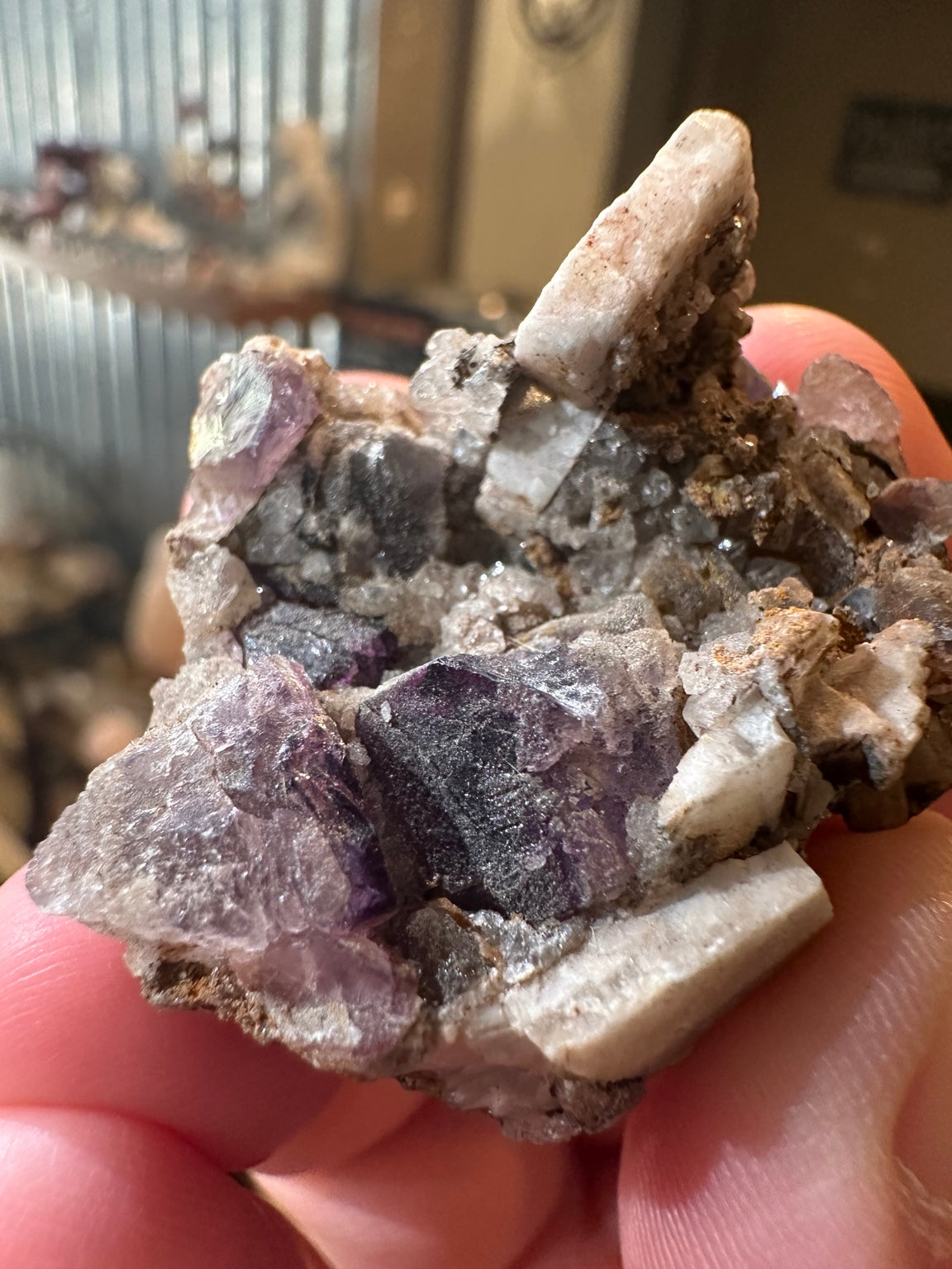 Purple fluorite crystal cluster on quartz-rich matrix from Mexico — view 3