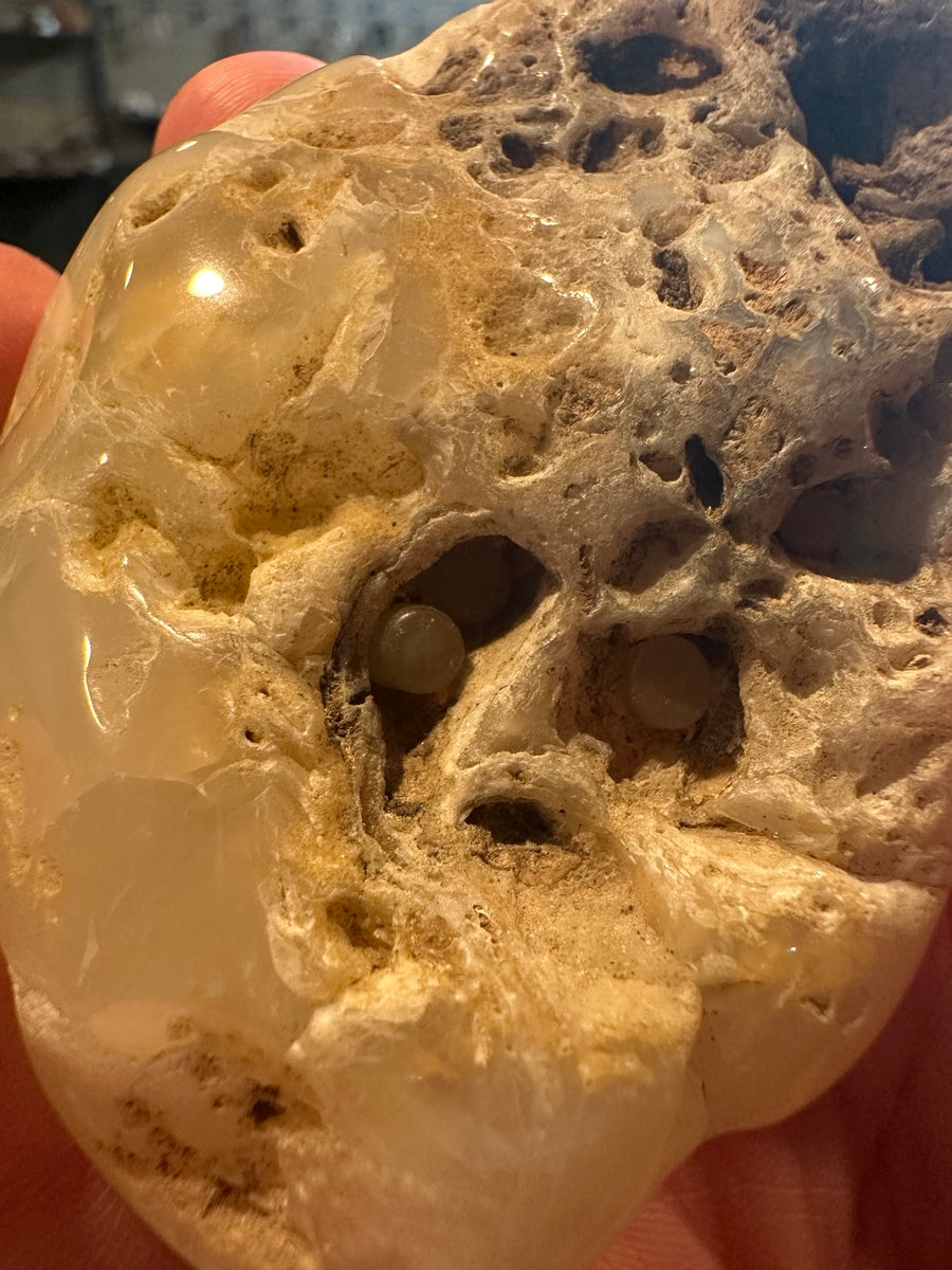 Exact polished chalcedony pocket stone with UV-reactive inclusions, 7.6 oz — view 1
